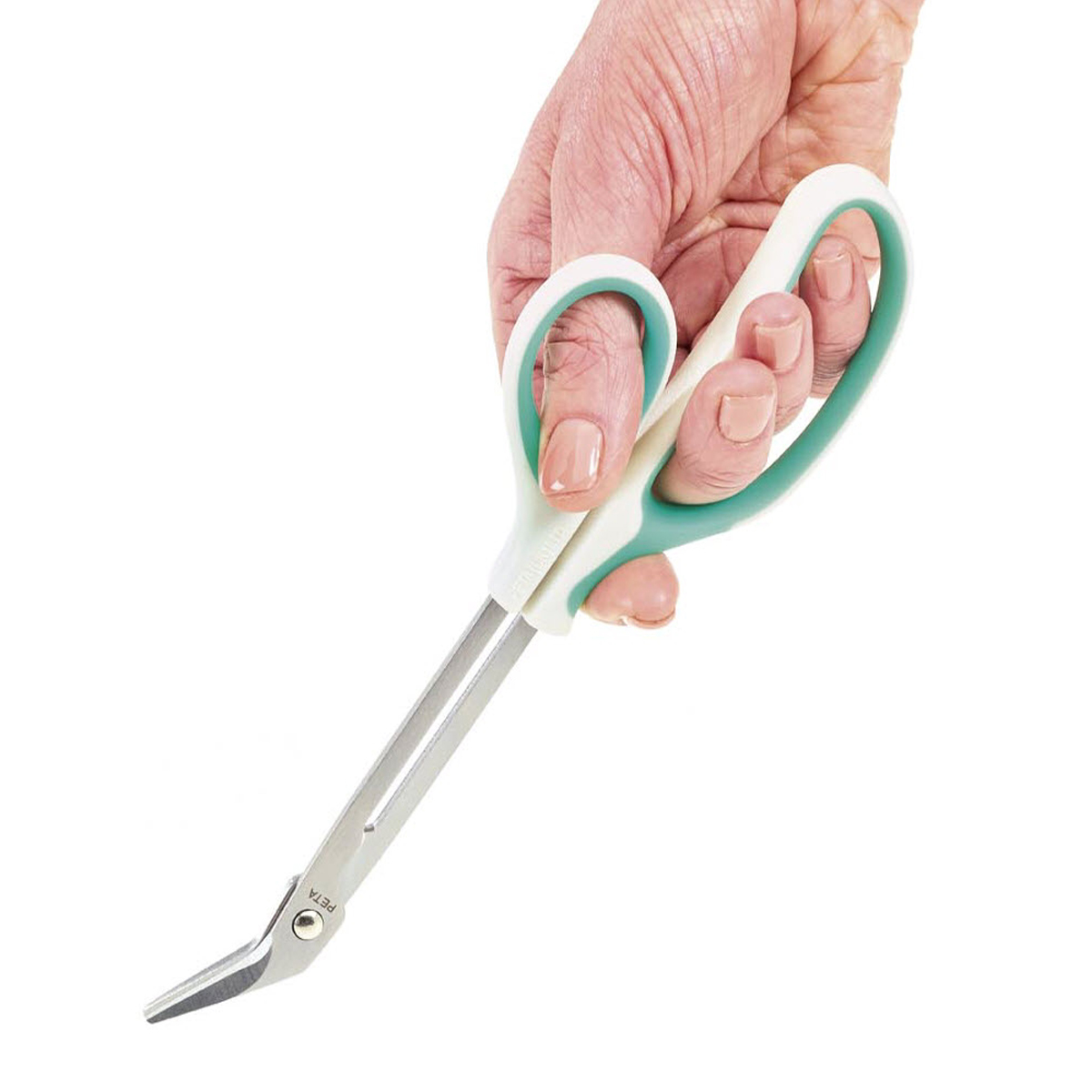 Mano sujetando la tijera.. Acceso a la galería. Abre nueva ventana